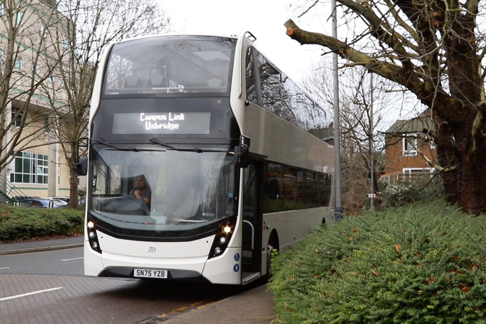 The side of a bus, displaying the BNU logo.